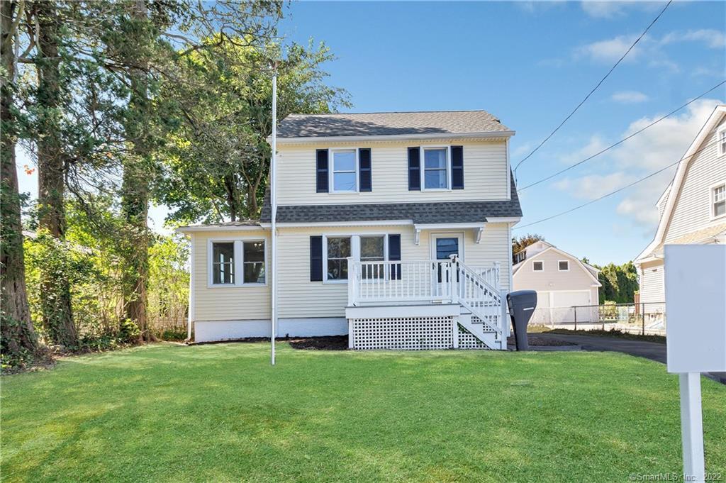 567 Huntington Road Stratford, CT 06614 - Photo 1 of 1 a front view of a house with a garden
