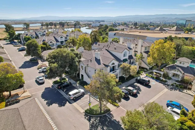 an aerial view of a house with a yard and fountain
