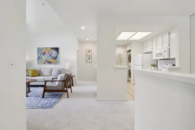 a view of kitchen with furniture and wooden floor