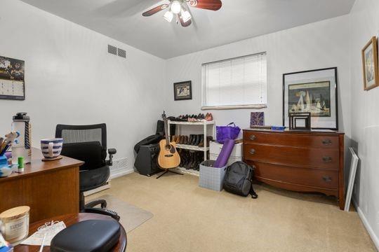 259 Republic Street Pittsburgh, PA 15211 - Photo 13 of 25 a bedroom with bed and a chandelier