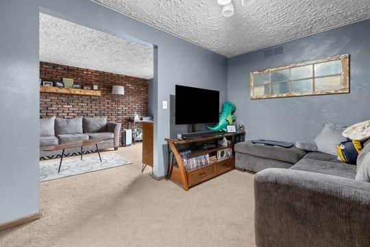259 Republic Street Pittsburgh, PA 15211 - Photo 17 of 25 a living room with furniture and a flat screen tv