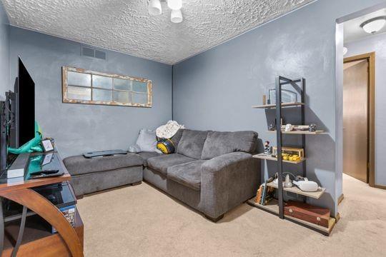 259 Republic Street Pittsburgh, PA 15211 - Photo 18 of 25 a living room with furniture and a flat screen tv