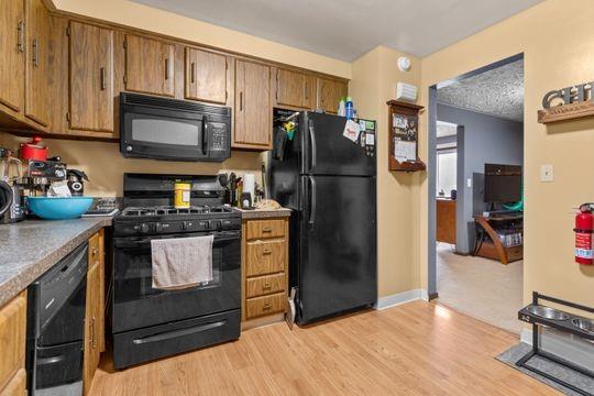 259 Republic Street Pittsburgh, PA 15211 - Photo 20 of 25 a kitchen with a refrigerator stove and cabinets