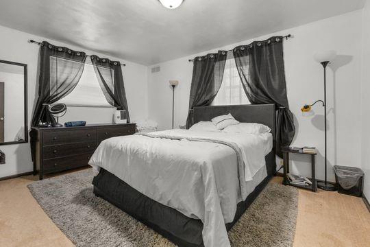 259 Republic Street Pittsburgh, PA 15211 - Photo 21 of 25 a bed room with a bed and a flat tv screen