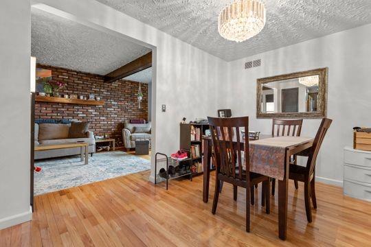 259 Republic Street Pittsburgh, PA 15211 - Photo 7 of 25 a living room with furniture and a wooden floor