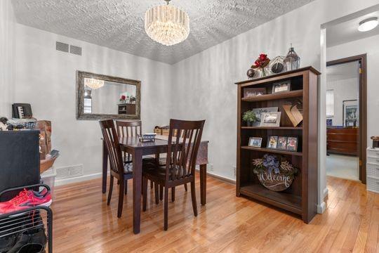 259 Republic Street Pittsburgh, PA 15211 - Photo 8 of 25 a view of a dining room with furniture and wooden floor