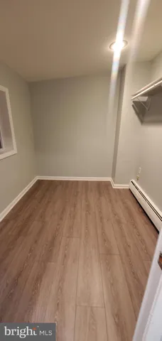 a view of room with wooden floor