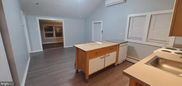 a utility room with sink dryer and washer