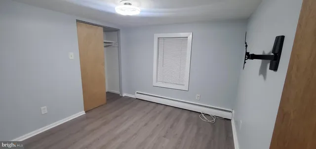 a view of an empty room with closet
