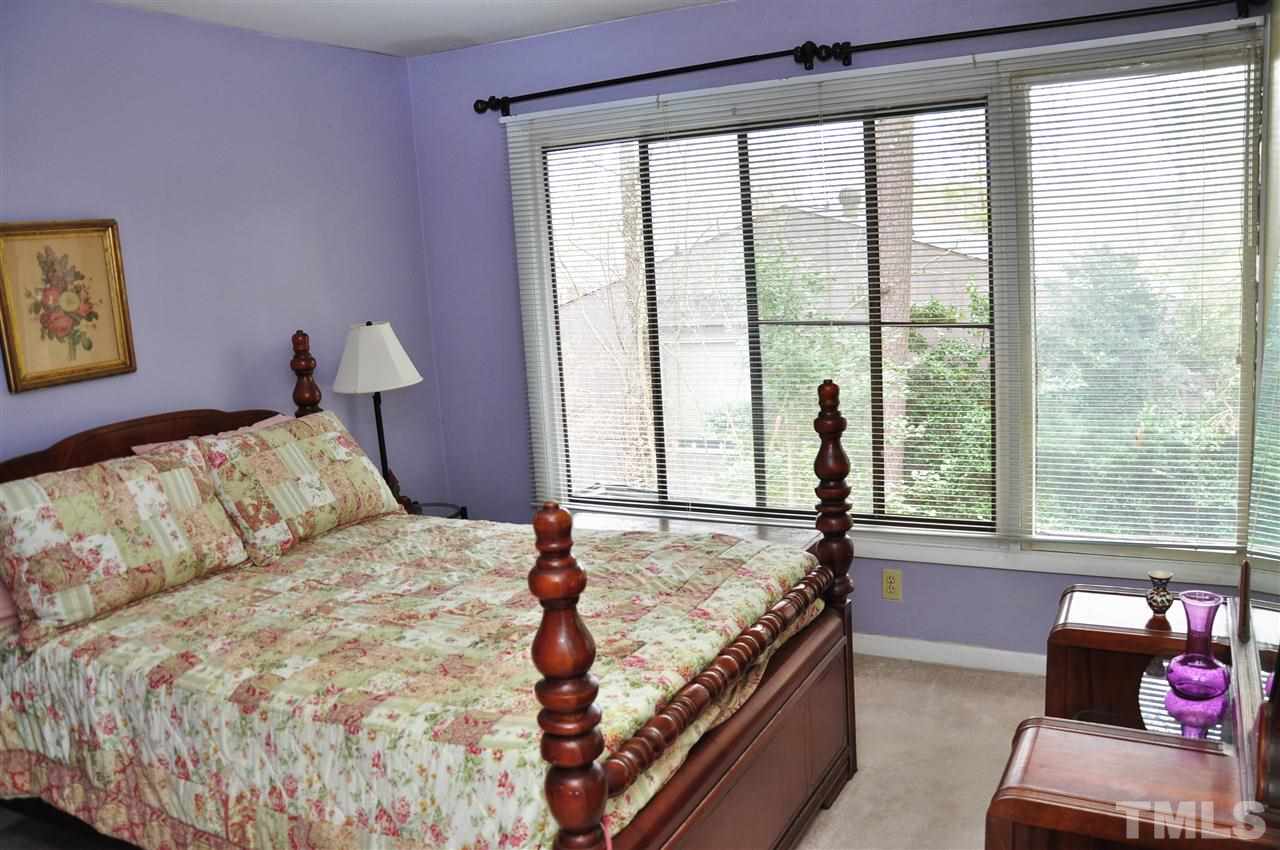 1774 Quail Ridge Road Raleigh, NC 27609 - Photo 12 of 25 a bedroom with a bed and a window