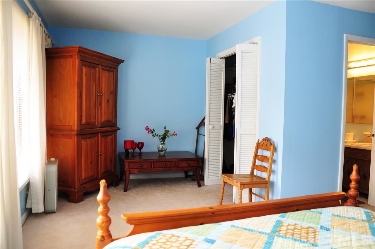 1774 Quail Ridge Road Raleigh, NC 27609 - Photo 17 of 25 a bedroom with furniture and a window