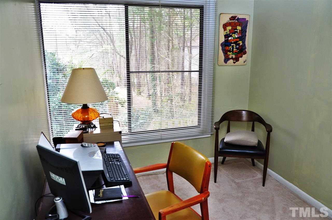 1774 Quail Ridge Road Raleigh, NC 27609 - Photo 19 of 25 a room with a chair and a window