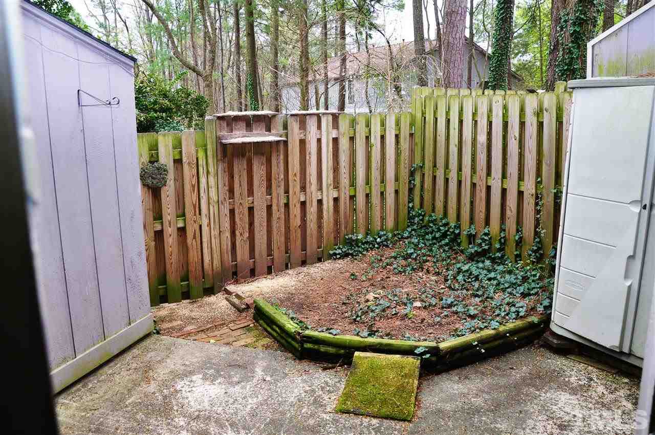 1774 Quail Ridge Road Raleigh, NC 27609 - Photo 22 of 25 a view of a backyard with plants