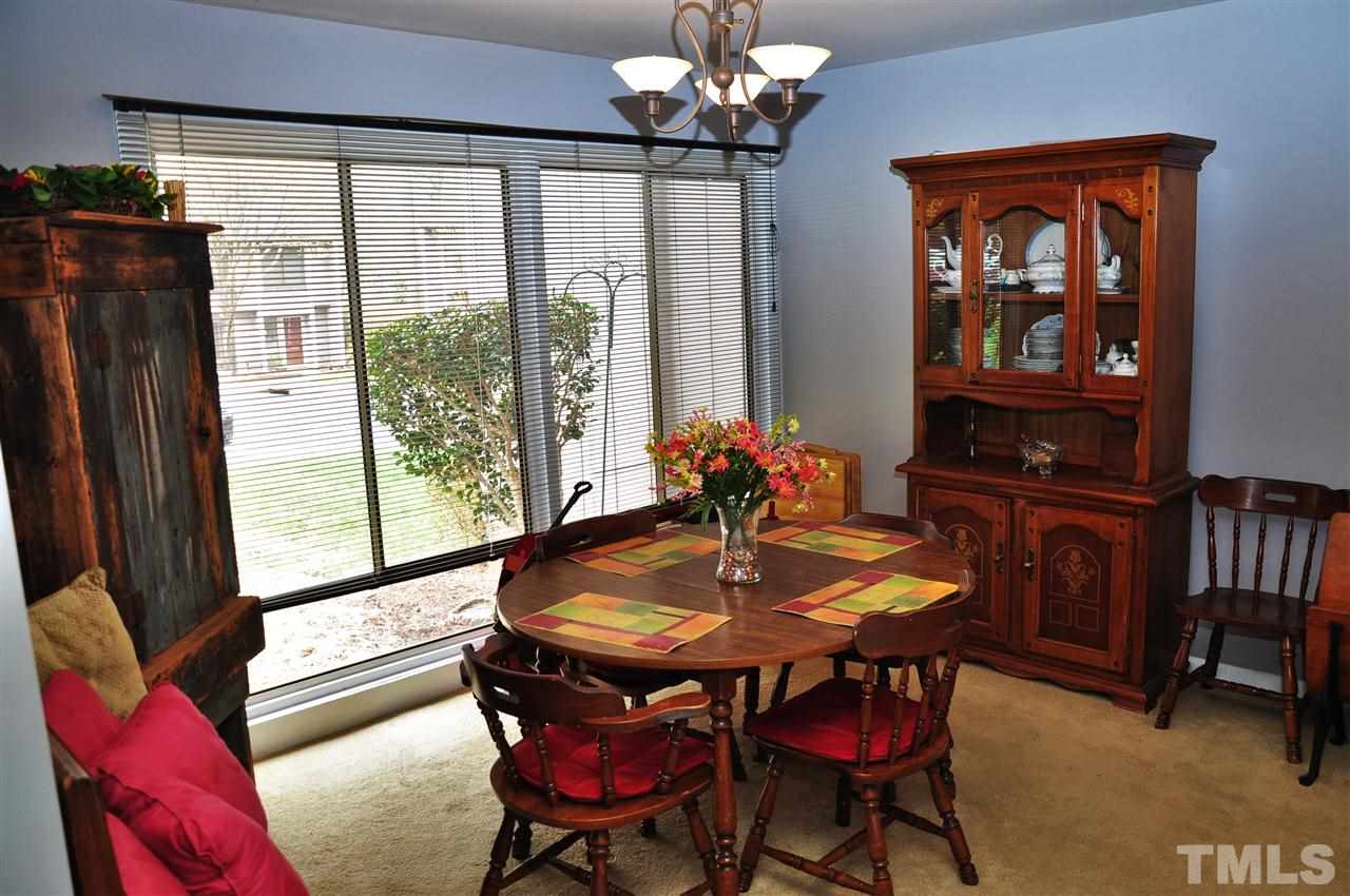 1774 Quail Ridge Road Raleigh, NC 27609 - Photo 8 of 25 a dining room with furniture and window