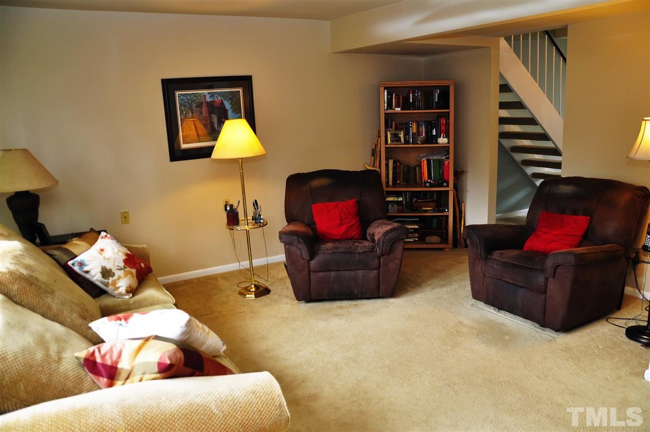 1774 Quail Ridge Road Raleigh, NC 27609 - Photo 10 of 25 a living room with furniture workspace and a window