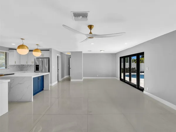 a view of a kitchen with a sink and cabinet with a stove