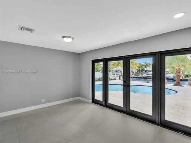 a view of an empty room with a large window