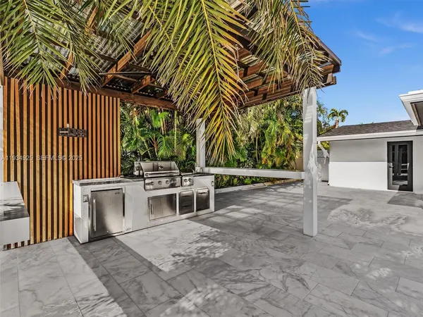 a view of a patio with a table and chairs