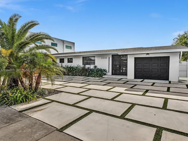 a view of house with yard street and seating space