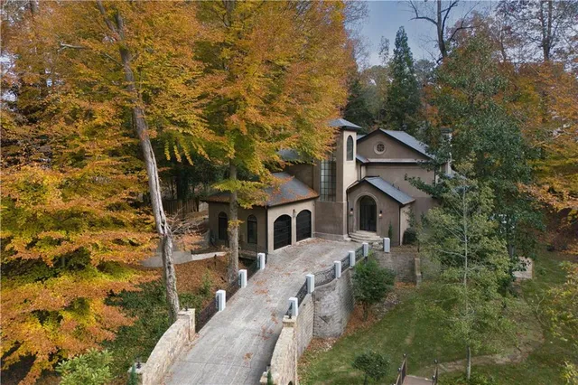 a view of house with yard and outdoor seating