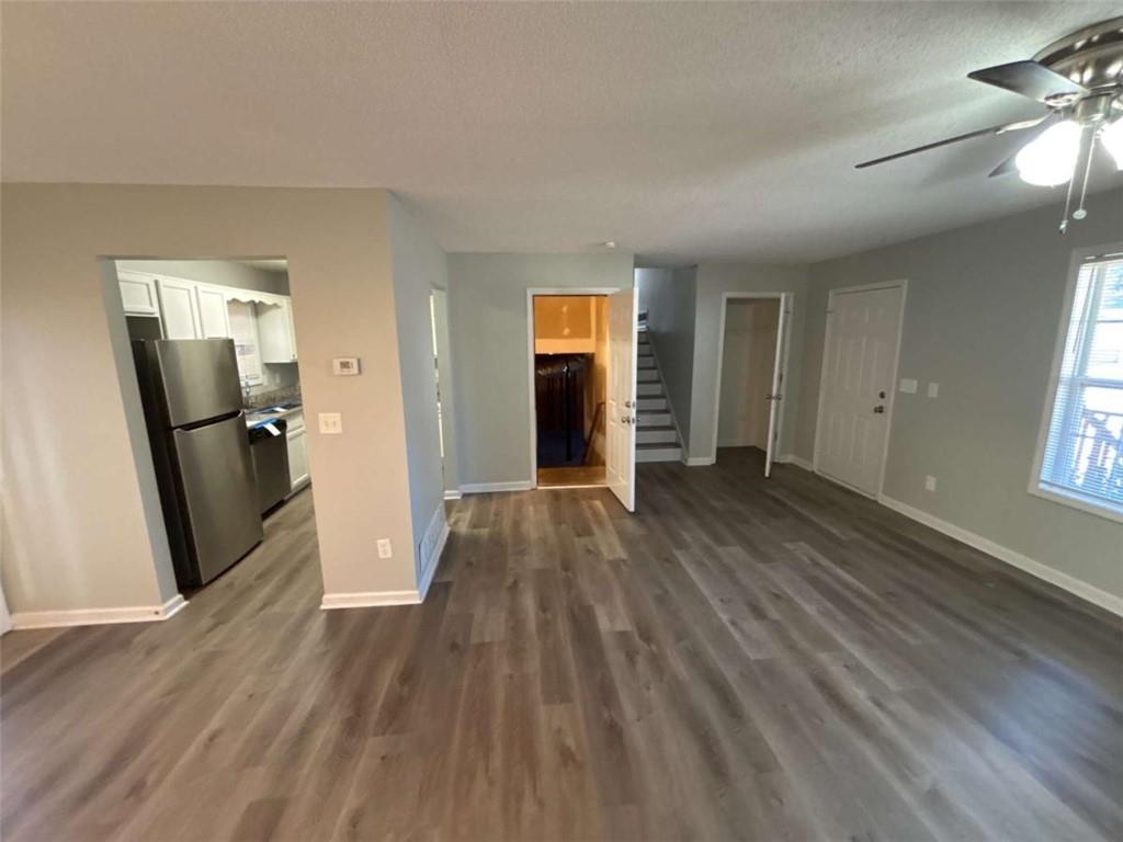 732 Newport Drive Villa Rica, GA 30180 - Photo 19 of 44 wooden floor in an empty room with a window