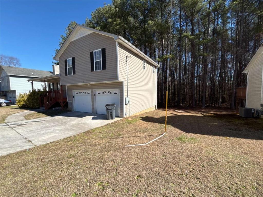 732 Newport Drive Villa Rica, GA 30180 - Photo 2 of 44 a house with trees in front of it