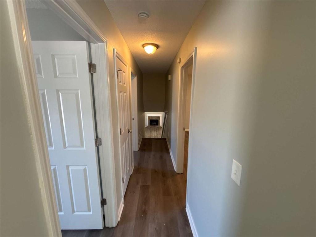 732 Newport Drive Villa Rica, GA 30180 - Photo 21 of 44 a view of a hallway with wooden floor and closet