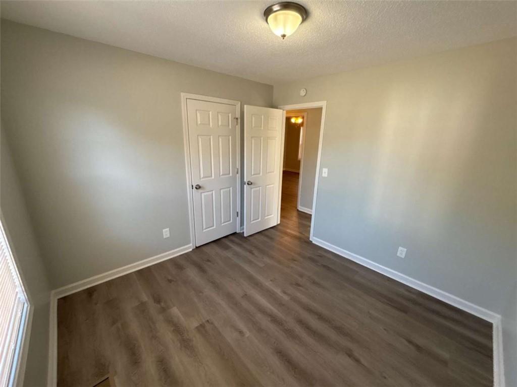 732 Newport Drive Villa Rica, GA 30180 - Photo 25 of 44 an empty room with wooden floor