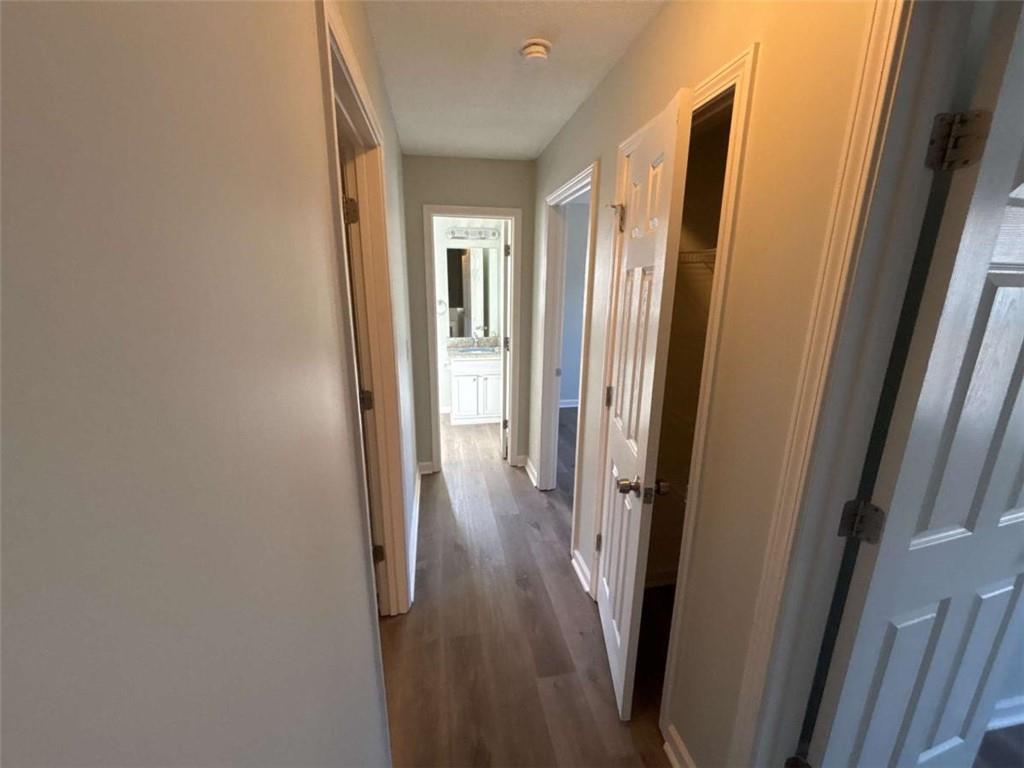 732 Newport Drive Villa Rica, GA 30180 - Photo 26 of 44 a view of a hallway with wooden floor and staircase
