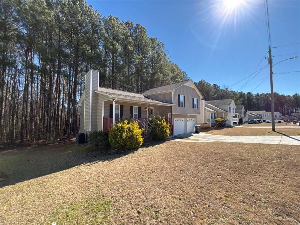 732 Newport Drive Villa Rica, GA 30180 - Photo 3 of 44 a front view of a house with a yard