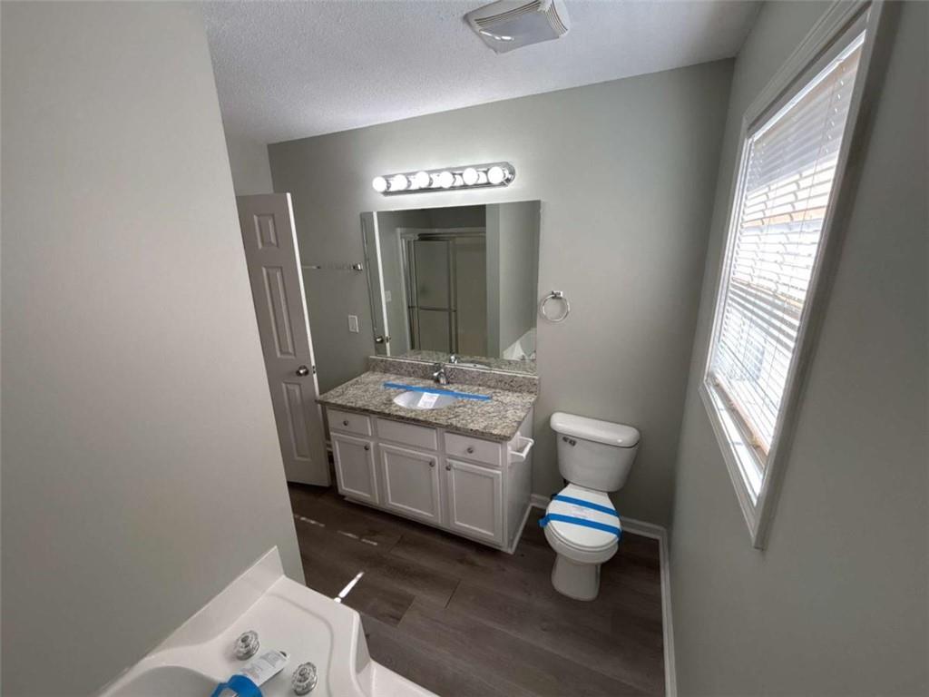 732 Newport Drive Villa Rica, GA 30180 - Photo 35 of 44 a bathroom with a toilet sink and mirror
