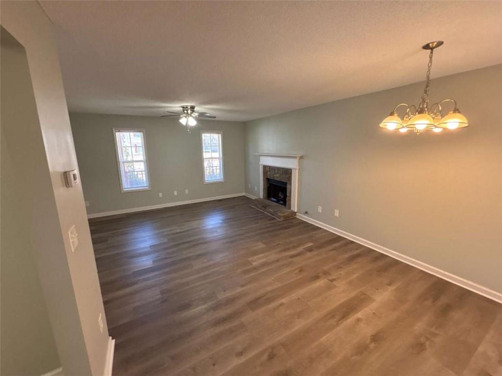 732 Newport Drive Villa Rica, GA 30180 - Photo 10 of 44 a view of an empty room with wooden floor and a window