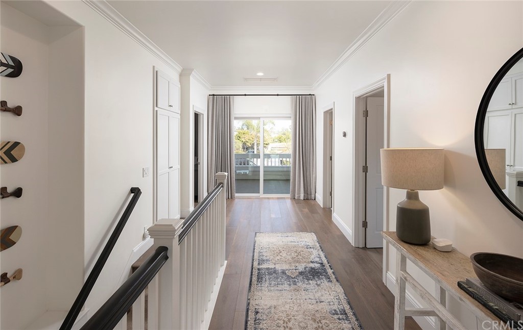 56 Balboa Newport Beach, CA 92663 - Photo 16 of 37 a view of hallway with wooden floor and furniture