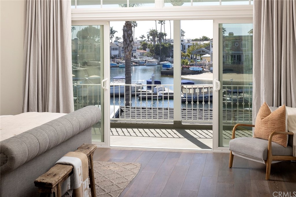 56 Balboa Newport Beach, CA 92663 - Photo 18 of 37 a living room with furniture and a floor to ceiling window