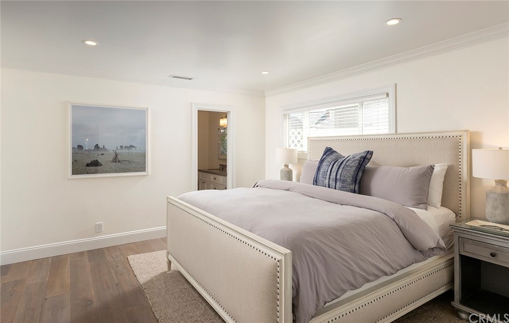 56 Balboa Newport Beach, CA 92663 - Photo 27 of 37 a bedroom with a bed and a window