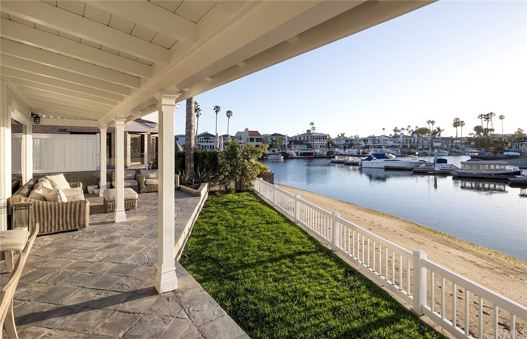 56 Balboa Newport Beach, CA 92663 - Photo 30 of 37 a view of a balcony with lake view and houses in the back