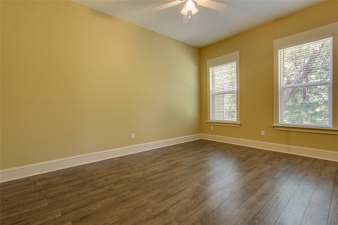 96155 Captains Pointe Road Yulee, FL 32097 - Photo 16 of 30 a view of an empty room with wooden floor and a window