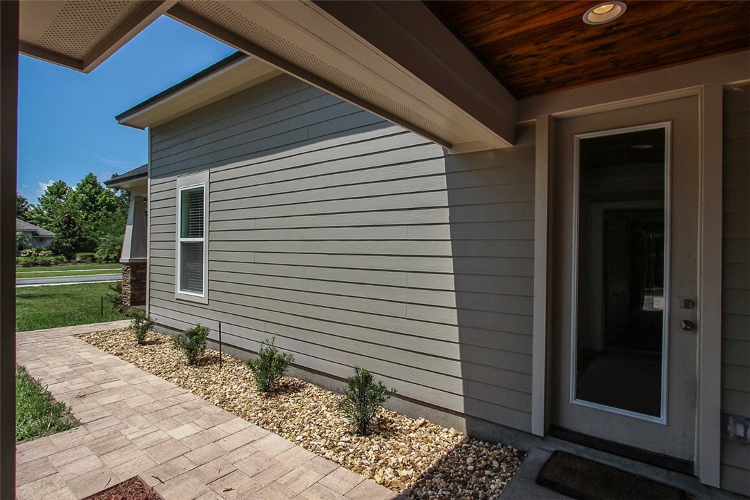 96155 Captains Pointe Road Yulee, FL 32097 - Photo 26 of 30 a side view of a house with a yard