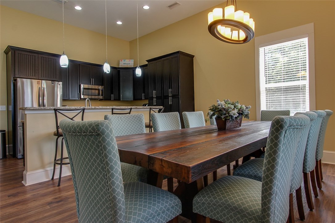 96155 Captains Pointe Road Yulee, FL 32097 - Photo 3 of 30 a dining room with furniture and wooden floor