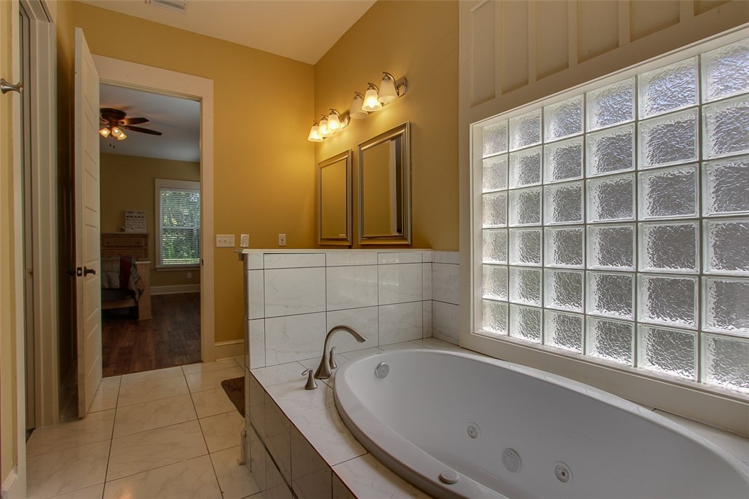96155 Captains Pointe Road Yulee, FL 32097 - Photo 5 of 30 a bathroom with a bathtub and a sink
