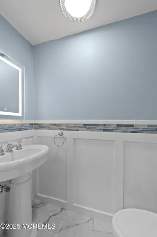 a bedroom with pink walls and pink rug