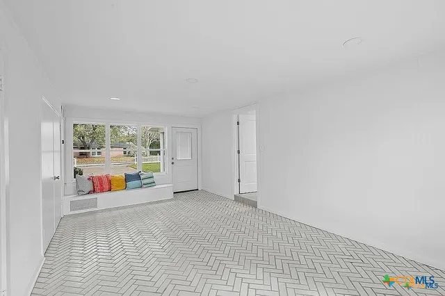 a spacious bathroom with a double vanity sink a mirror and a bathtub