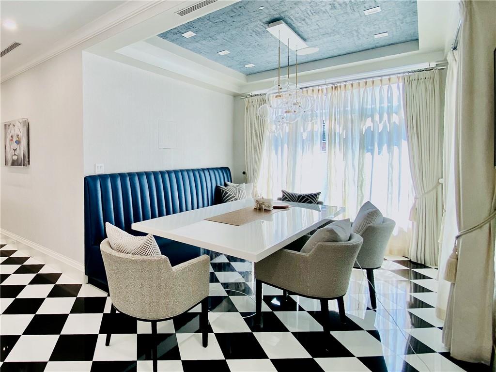 222 Exeter Street Brooklyn, NY 11235 - Photo 12 of 39 a view of a dining room with furniture and rug