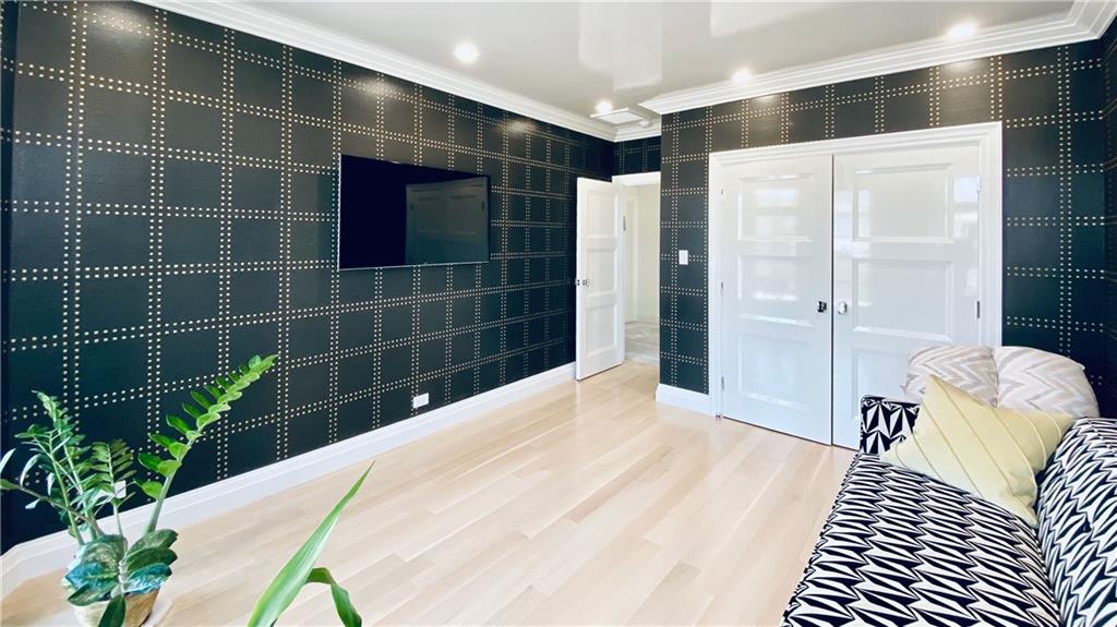222 Exeter Street Brooklyn, NY 11235 - Photo 23 of 39 a bathroom with a bathtub and shower
