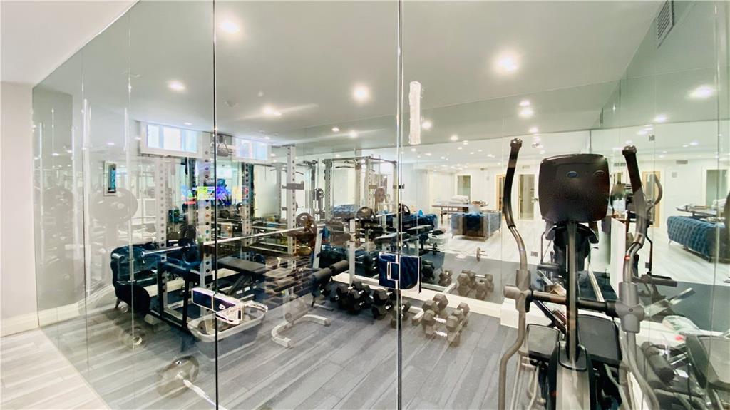 222 Exeter Street Brooklyn, NY 11235 - Photo 26 of 39 a view of a room with gym equipment