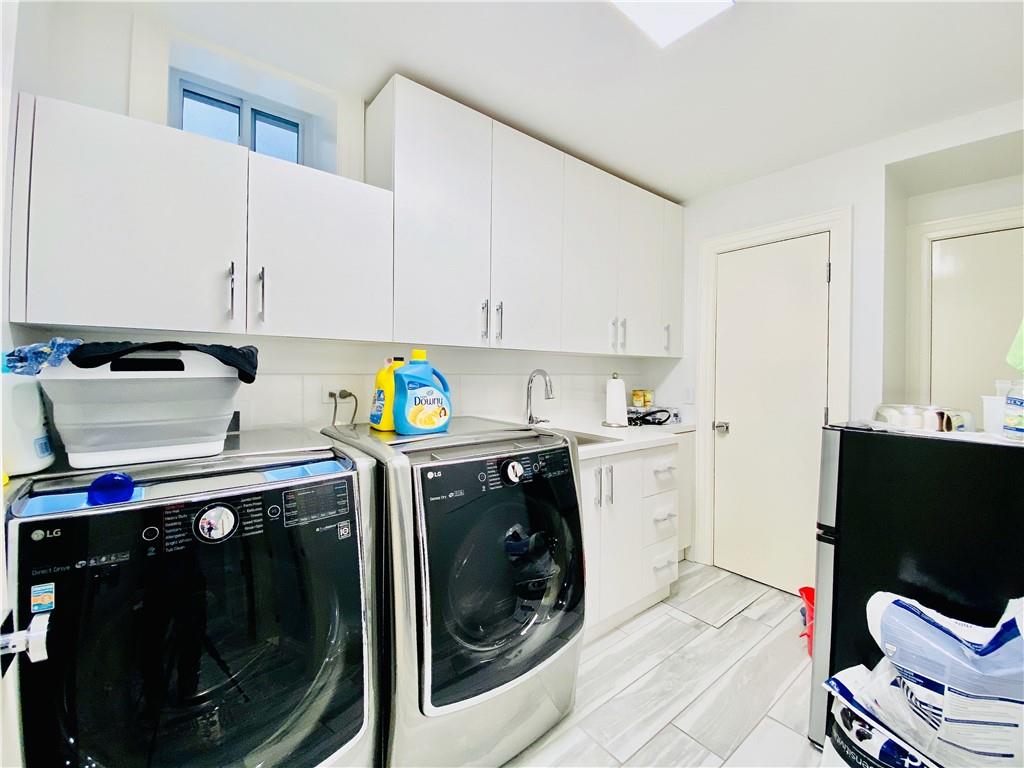 222 Exeter Street Brooklyn, NY 11235 - Photo 32 of 39 a utility room with dryer and washer