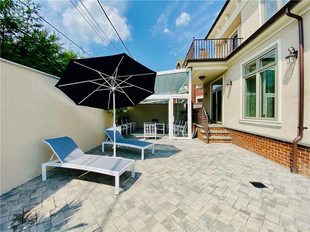 222 Exeter Street Brooklyn, NY 11235 - Photo 35 of 39 a patio with a table and chairs
