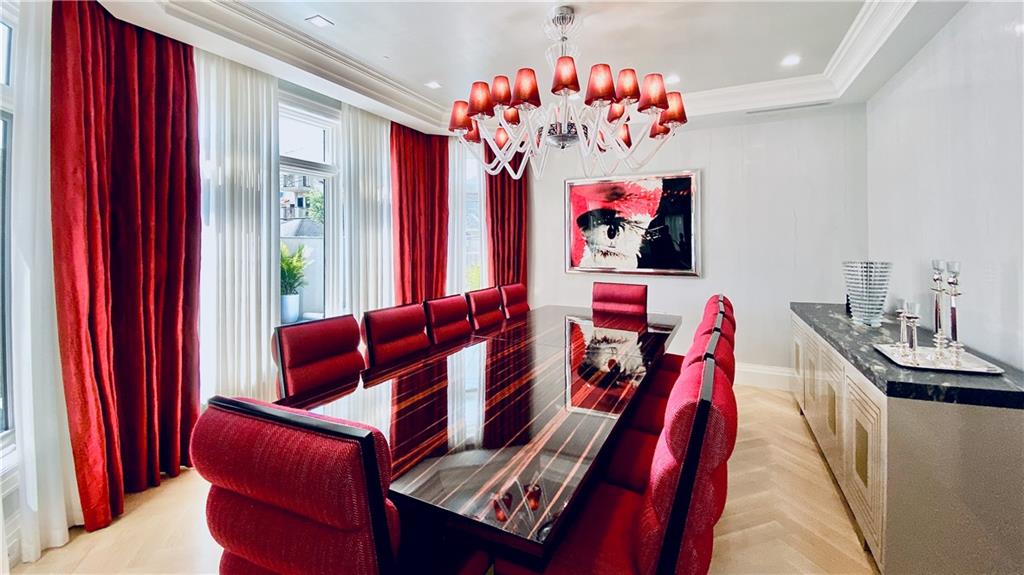 222 Exeter Street Brooklyn, NY 11235 - Photo 9 of 39 a view of a living room with furniture and a chandelier