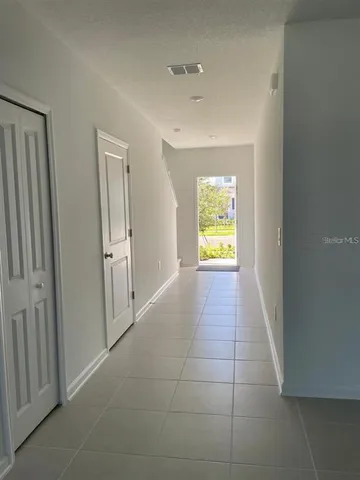 a view of an empty room and a window