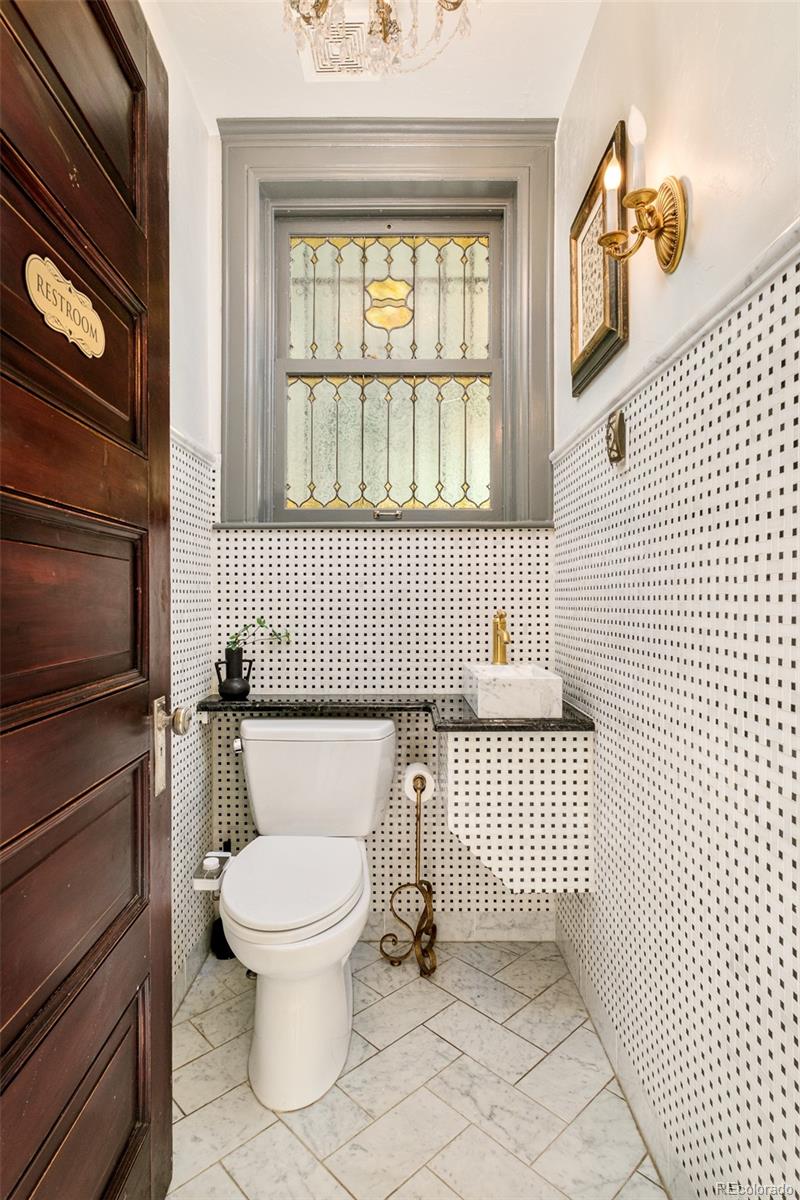 680 North Clarkson Street Denver, CO 80218 - Photo 12 of 39 a bathroom with a toilet